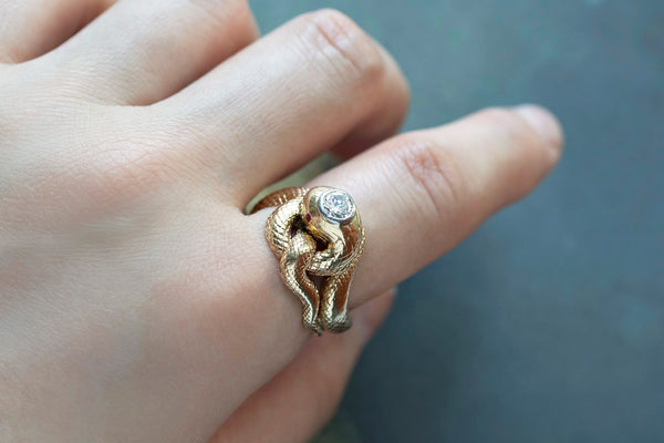 Gold snake ring on sale with ruby eyes meaning